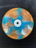 Orange/blue/pearlescent swirl glow bottom white thumb piece spini